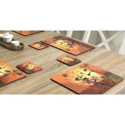 Stylish set of Sunset design square drinks coasters. Shown against wooden dining table